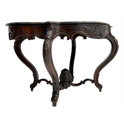 19th century Irish rosewood centre table, the shaped and moulded top over shaped apron carved with scrolled foliage, on serpentine supports carved with bell flowers, the supports united by anthemion carved finial and s-scroll x-framed stretchers