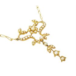 Edwardian gold split pearl pendant necklace, openwork floral pendant set with split pearls on a fancy link chain necklace