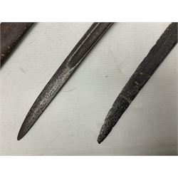 French Model 1874 Epee bayonet marked Oulle 1876 in associated scabbard; Model 1866 sabre bayonet in cut-down sword scabbard; and Model 1842/59 sabre bayonet in relic condition (3)