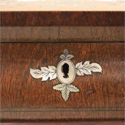 Victorian mahogany and mother-of-pearl inlaid work table, the octagonal hinged top enclosing a mirror and fitted compartmented interior, raised on a carved pedestal and quatriform platform base with scrolled feet