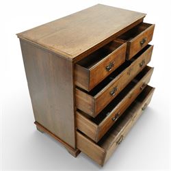 George III oak chest of drawers, the plain moulded top above a two over three drawer arrangement with pierced brass fittings, the case raised on bracket feet
