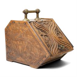 Arts & Crafts period oak coal box, each side carved with urn and spilling flowers, the cov...