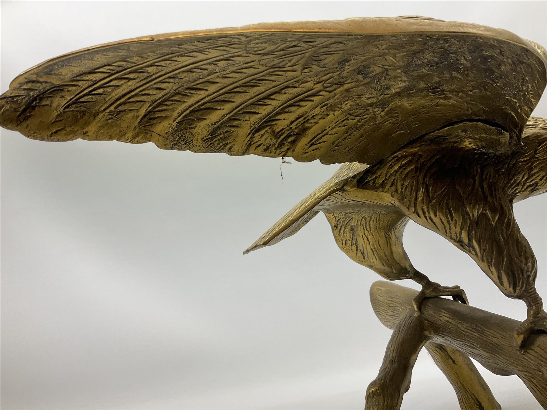 Large brass figure of an eagle on a branch, H51.5cm