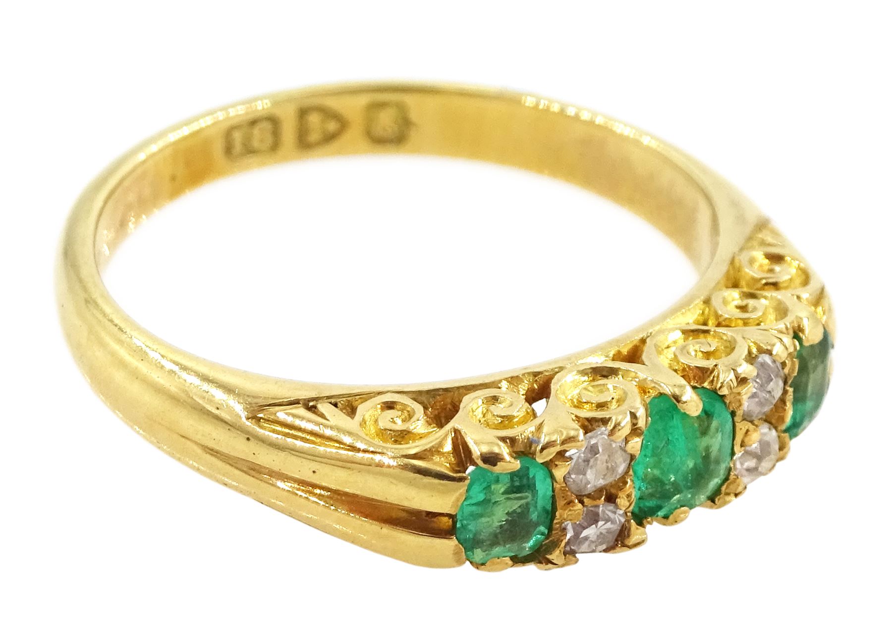Edwardian 18ct gold three stone emerald and four stone old cut diamond ring, Chester 1905
