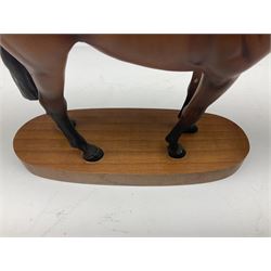 Beswick 'Mill Reef' horse figure, on a wooden plinth together with Beswick Ware horse figure 'Red Rum' on wood plinth, both with printed mark beneath