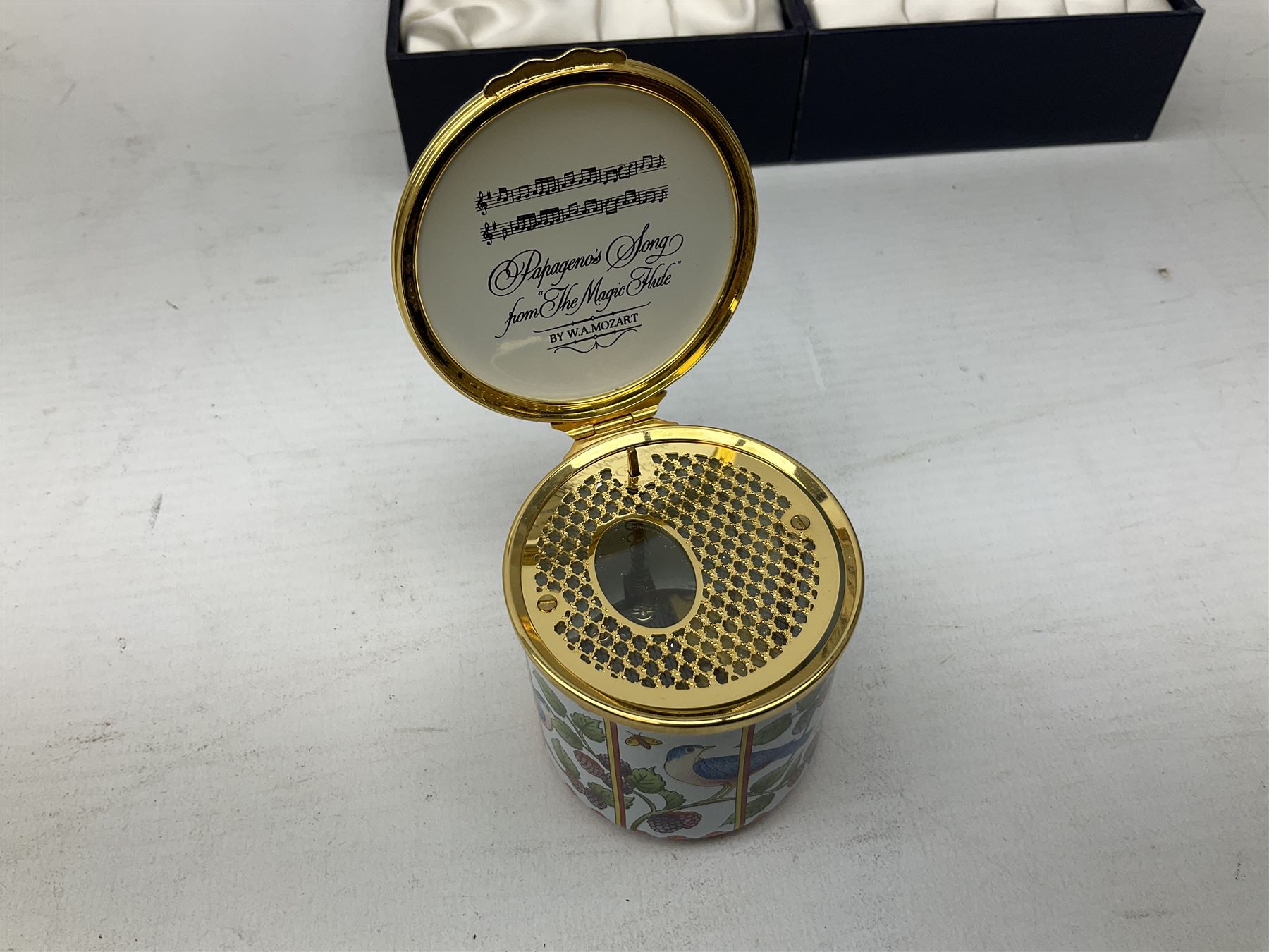 Two Halcyon Days enamel musical boxes, the first example playing Papageno's Song from the Magic Flute by W A Mozart, the second The Carousel Waltz composed by Richard Rodgers for the 1956 film Carousel, each in fitted box 