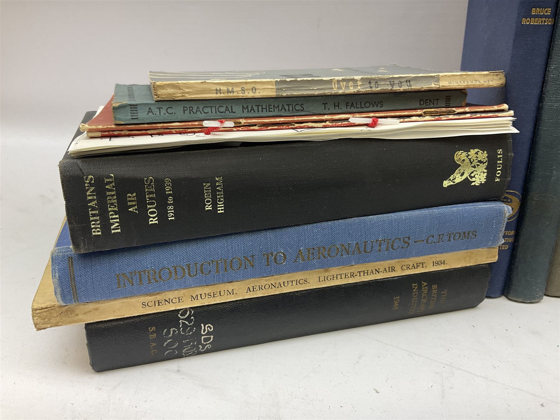 Aircraft of the Fighting Powers. Five volumes. 1940-44 including two copies of volume three; Royal Air Force Flying Review. Six volumes. 1956-63. Uniformly bound in blue cloth with gilt RAF crest to front covers; and ten other books of aircraft and aeronautica interest.