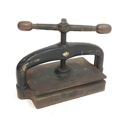 A late 19th century cast iron book press, L48cm, H36cm.