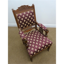  Edwardian three piece salon suite comprising: walnut framed chaise longue, upholstered in a maroon and gold patterned fabric, gallery back, turned supports (L180cm) and pair Ladies and Gents upholstered armchairs (3)  