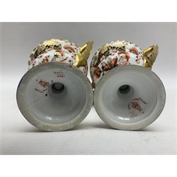 Pair of Royal Crown Derby 6299 Imari pattern twin handled trophy vases, of wasted cylindrical form, with printed mark beneath, H13cm 