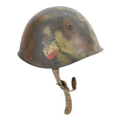 Italian RSI/10th M.A.S. Flotilla (Decima Flottiglia MAS). M33 Camouflage helmet- re-issued to the G.N.R. Circa.1944/45
extremely rare Italian M33 steel helmet in camouflage paintwork which belongd to the famous 'Decima Flottiglia MAS' the Italian Elite Naval Commandos. The helmet retains the Italian tri-colour to oneside, the yellow anchor to the front and the red X to the other side. the helmet is complete with its correct liner and chinstrap. When it was re-isseued it was painted in camouflage with the new insignia to the front of the G.N.R. 'Guardia Nazionale Republican' and this camouflage was only used to the latter part of WWII by R.S.I (Repubblica Sociale Italiana)   
