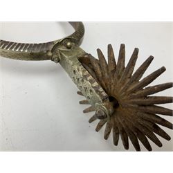 Pair of late 19th century South American iron spurs, engraved silver mounts, with sunburst rowls
