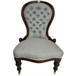 Victorian walnut framed open armchair, scrolled arm terminals over spiral turned arm supports, upholstered in foliate patterned fabric with sprung seat, on turned supports and brass castors (W65cm H92cm); and Victorian mahogany nursing chair with lobe carved supports (W60cm H92cm)