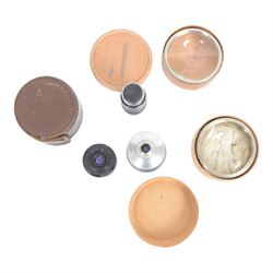 Collection of camera lenses, including Tamron 1:3.5 f=200mm, Makinon MC Zoom 1:3-4.5 35mm-105mm, Topcor 1:4 f=100mm, Acall 6.5mm f:1.4 wide angle lens, etc