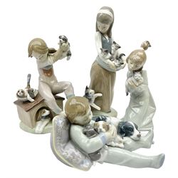 Four Lladro figures, comprising Sweet Dreams no 1535, Following Her Cats no 1309, Sleepy Kitten No 5712 and Pick of the Litter no 7621, all with original boxes, largest example H24cm