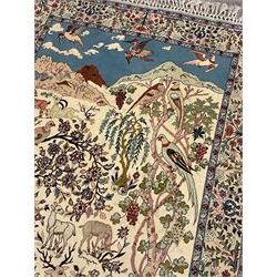 Fine Persian tree of life rug wall hanging, ivory ground field depicting landscape filled with animals, birds and flowers, the guarded border with stylised flower heads and foliage decoration, with brass hanging rail
