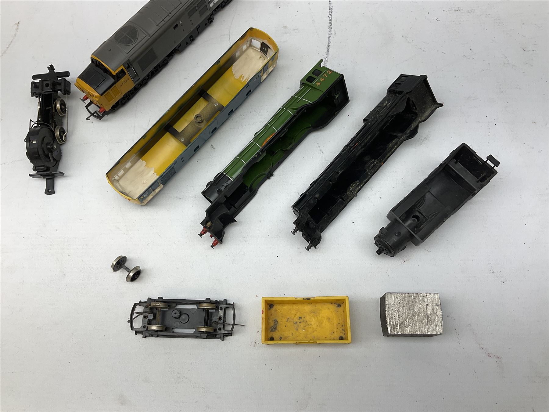 '00' gauge - Tri-ang 'Caledonian Single' Class 4-2-2 locomotive and tender; Hornby Class 37 Diesel (English Electric Type 3) locomotive No.37063; Airfix Class 61XX 2-6-2 Prairie tank locomotive No.6167; Pocher Italy American style 4-4-0 locomotive 'Reno'; and a quantity of part locomotives, spare parts etc; all unboxed