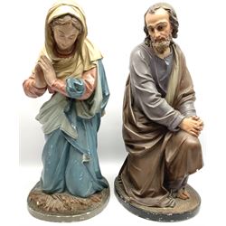 Two religious painted plaster figures of Mary and Joseph kneeling on oval plinths, with impressed mark 'Raffl et Cie Paris', H60cm 
