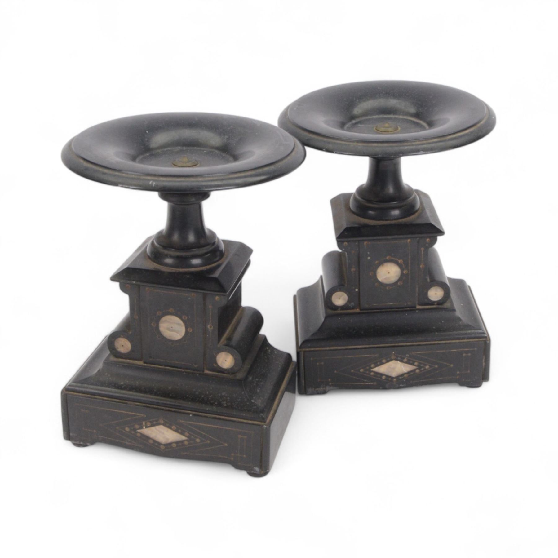 French-late 19th century Belgium slate mantle clock with a break-front case, flat pediment and deep moulded plinth, with recessed green and white variegated marble columns to the front, enamel dial with Roman numerals and steel moon hands, countwheel striking movement sounding the hours and half-hours on a bell. With key and pendulum. With an associated pair of 24cm high Tazzas..