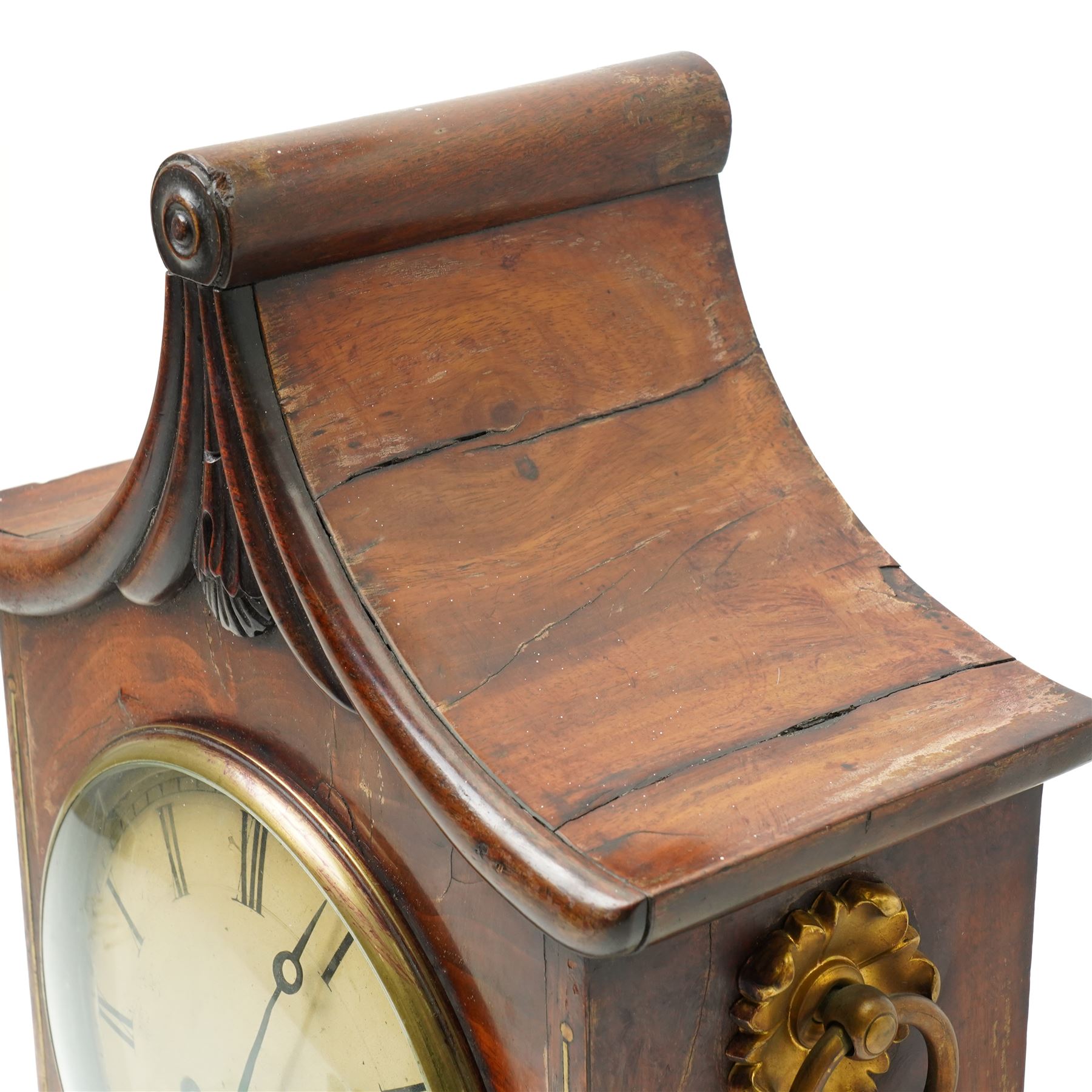 William IV mahogany and brass mounted bracket clock, the rectangular case with swept pagoda top with acanthus carved and rosette applied decoration, the sides with circular pierced brass fabric covered apertures and brass carrying handles, dial with 8 inch painted Roman chapters with pierced steel hands, the brass four pillar twin wire fusee 8-day movement with anchor escapement striking on a bell, lacking pendulum 