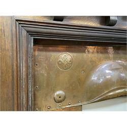 Late 19th/early 20th century fireplace, oak surround with projecting dentil cornice over bevelled mirror and shelf, with copper inset decorated with Heraldic knot motifs and rivets, together with various fire accessories 