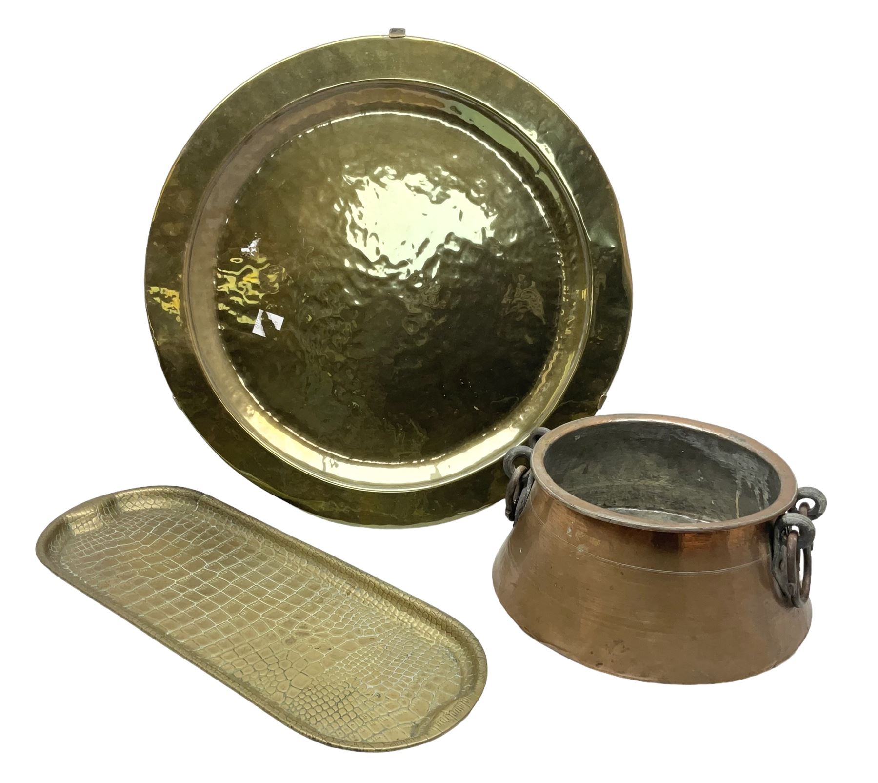 Copper pot with twin iron handles, large heavy planished brass charger and brass crocodile tray, charger D59cm