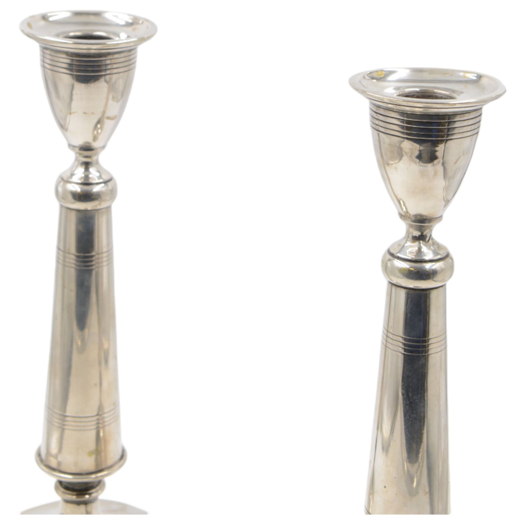 Pair of late 19th/early 20th century Austro-Hungarian 800 standard silver candlesticks, with tapering stems upon a domed base, stamped with Diana head with number 3 to the left, H33cm