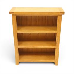 Contemporary solid oak open bookcase, rectangular top over three shelves, on chamfered square feet