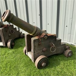 Pair of hardwood framed, cast iron barrel garden cannons, on metal wheels  - THIS LOT IS TO BE COLLECTED BY APPOINTMENT FROM DUGGLEBY STORAGE, GREAT HILL, EASTFIELD, SCARBOROUGH, YO11 3TX