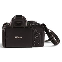 Nikon D5100 DSLR camera body, serial no. 6298157, with user manual, battery charger and Magic Lantern guide