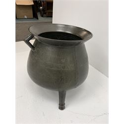 Late 17th/early 18th century bronze cauldron, of bellied form with flared rim and twin angular handles, upon three ribbed outswept feet, detailed with a decorative band beneath four arc founder's mark for John Sturton (I or II) of South Petherton, Somerset and a capital 'I', H40cm, rim D36cm