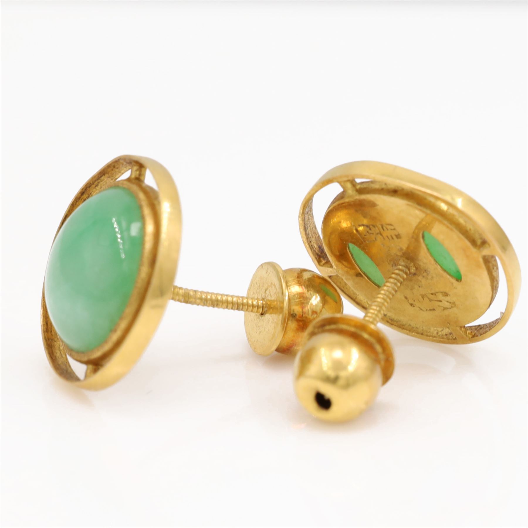 Pair of 21ct gold jadeite earrings, each screw back stud set with a circular cabochon jadeite