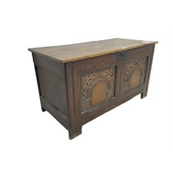 Jacobean Revival - 19th century oak blanket chest, rectangular hinged top, the two front panels carved arched foliate decoration, raised on stile supports
