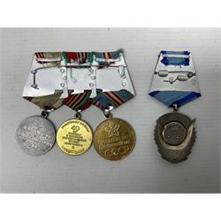 USSR Order of the Red banner of Labor Medal No.1173358; and a group of three other Russian medals including Jubilee Medal fifty years of the Armed Forces, 40th Anniversary Medal etc; all with ribbons on wearing bar