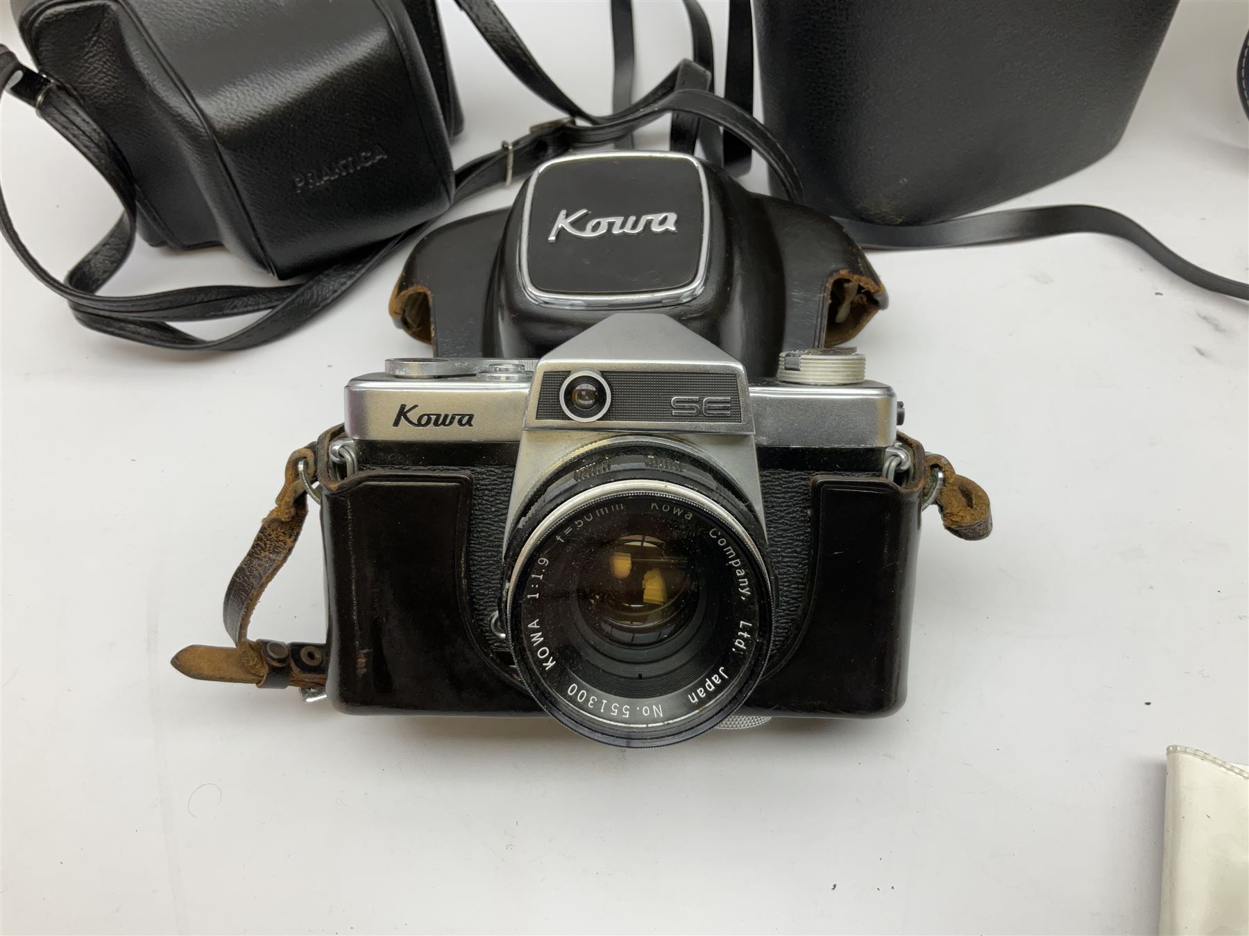 Quantity of Cameras , Lenses and Table Top Viewer- To be assessed 
Collection of cameras, lenses and photography equipment, to include Praktica EE2, Kowa SE, Kodak 66 model II, Inovar, lens Carl Zeiss Jena DDR Flektogon 2.4/35, lens Pentacon Electric f/2.8 135mm, Sunpak auto 2020, tripod  etc, together with a pair of Mark Scheffel 10x50 field binoculars.  