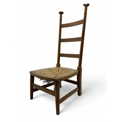 Attributed to William Birch of High Wycombe - Arts & Crafts oak ladder-back side chair, with turned finials, rush seat, and stretchers, raised on square-section supports; 19th century mahogany Pembroke table, rectangular drop-leaf top raised on turned supports with central stretcher and splayed feet