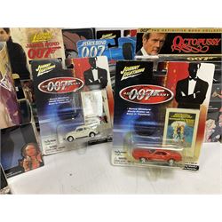 Corgi - The Definitive Bond Collection and The Director's Cut - nine die-cast vehicles from You Only Live Twice, Goldfinger, For Your Eyes Only, Diamonds Are Forever etc; Corgi Classics Moonraker Shuttle and Lotus Esprit; two other Corgi James Bond packs; Carrera Die Another Day Aston Martin V12 Vanquish; nine Johnny Lightning carded James Bond vehicles; Dragon carded Wai Lin figure; and three Fabbri tanks; all boxed/packaged (27)