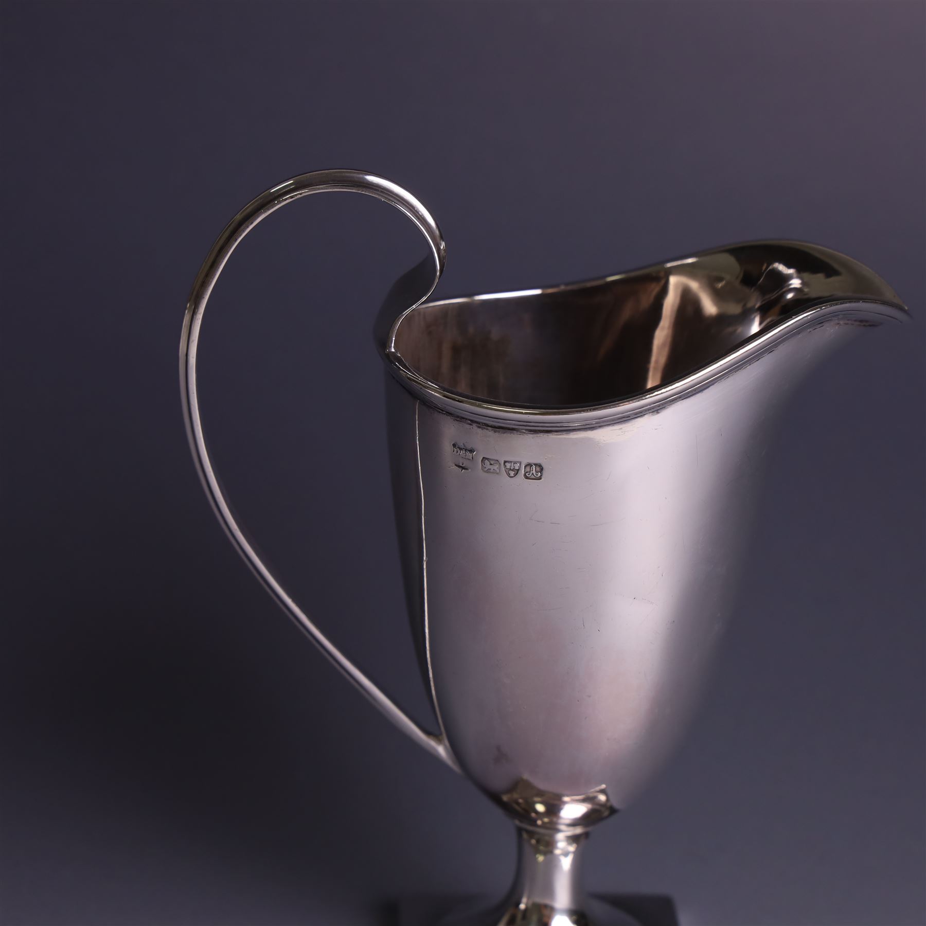 Edwardian silver helmet shaped cream jug, with plain bowl and upon a square base, hallmarked D & M Davis , Chester 1901, H13cm