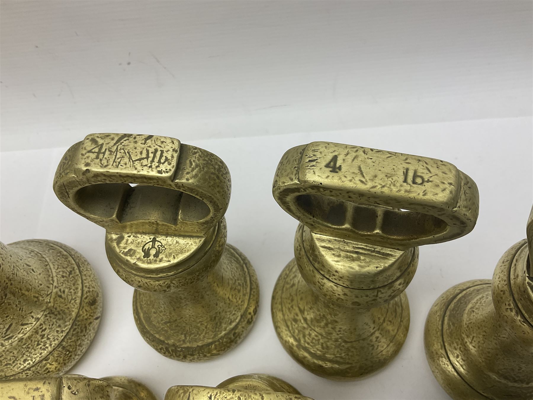 Set of seventeen Victorian brass bell weights