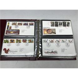 Great British Queen Elizabeth II first day covers including various issues for the Millennium etc, many with printed addresses and special postmarks, housed in three 'Royal Mail First Day Covers' ring binder folders and three Royal Mail special stamps books dated  1997, 1998 and 1999 complete with mint stamps