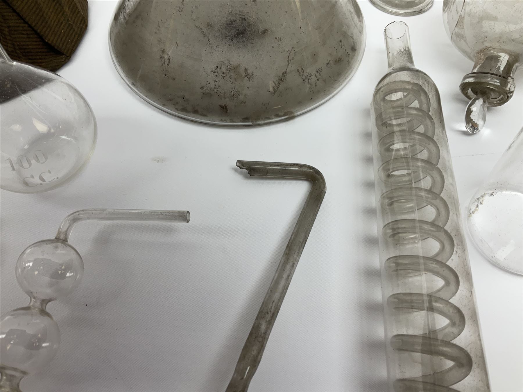 Collection of 19th century and later pharmaceutical laboratory glass, to include, volumetric flasks of various sizes, conical flask, stratus flask, etc (25) Provenance: discovered in the storeroom of a long established Hull pharmacist and opticians