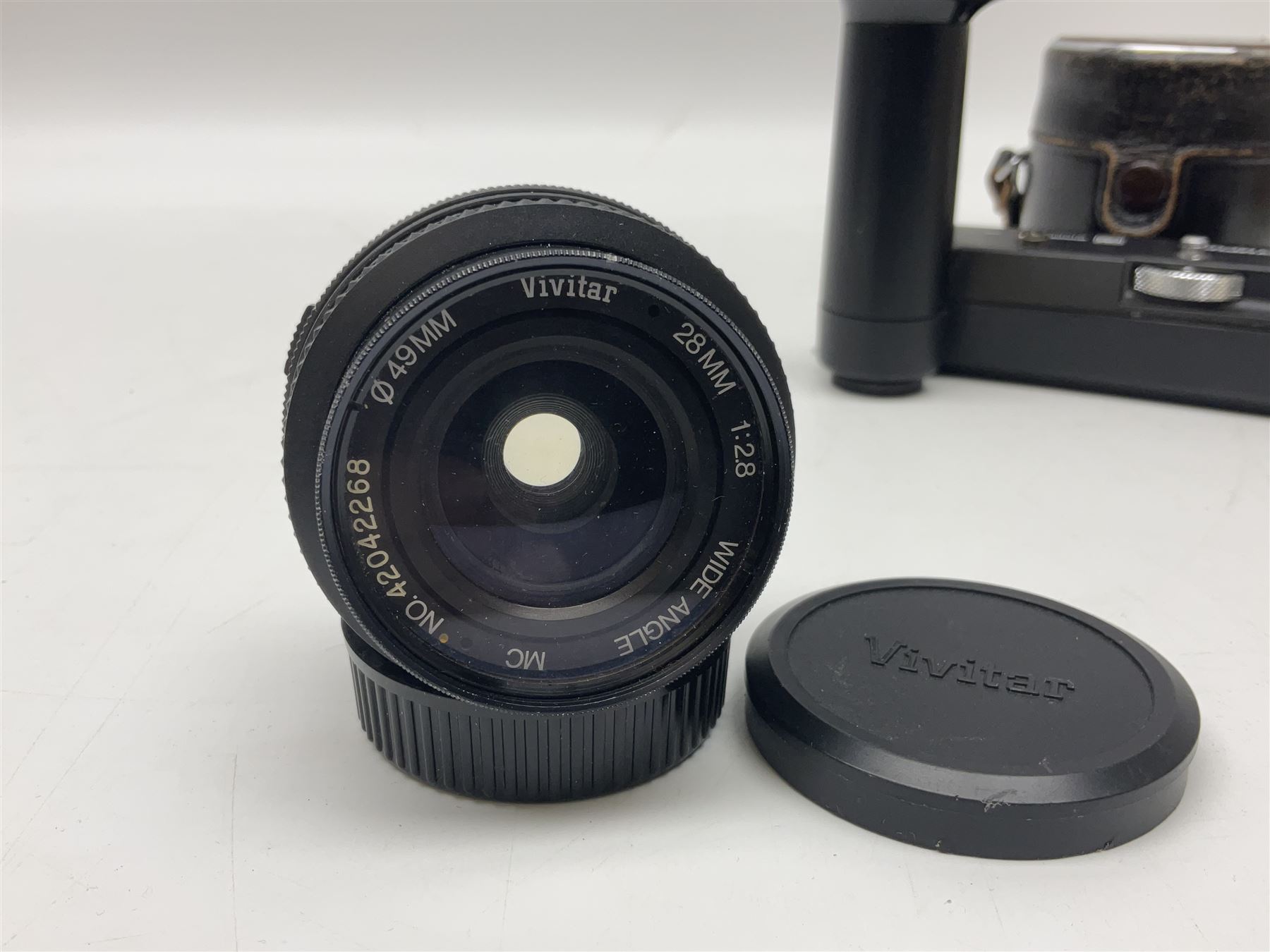 Olympus OM-1 camera body, serial no 913212, with 'Olympus OM-System F.Zuiko Auto-S 1:1.8 f=50mm' lens, serial no.74374, 'Vivitar wide angle MC 28mm 1:2.8 49mm' lens, serial no. 42042268, and Olympus OM winder 2