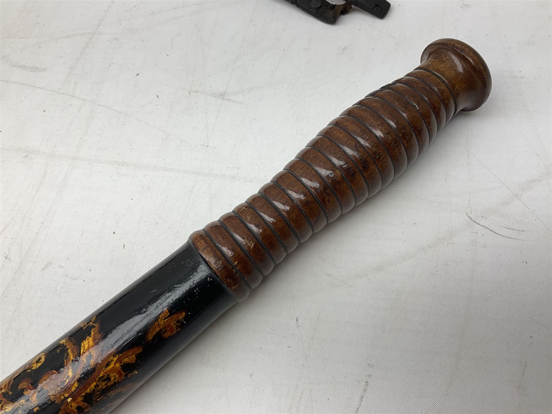 Victorian painted turned wood police truncheon by Field, dated 1851 painted in polychrome with the arms of Blackburn, including crest flanked by the date 18/51 and circumscribed BLACKBURN BOROUGH POLICE, stamped 'FIELD 233 HOLBORN'. L40.5cm. Auctioneer's Note: The borough of Blackburn received its Charter of Incorporation on 28 August 1851; together with two other unmarked turned wooden truncheons (3)