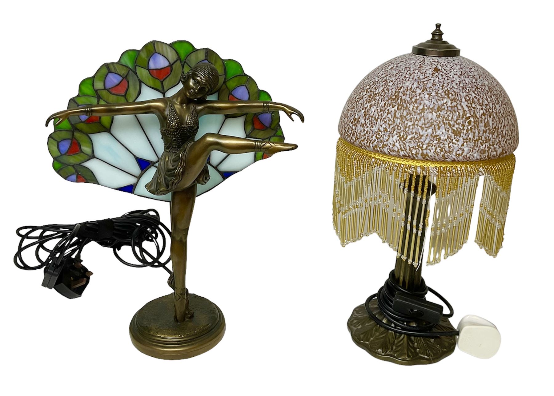 Art Deco Tiffany style table lamp, modelled as a dancer with a fan shaped shade, together with another table lamp with mottled glass and tassel shade, tallest H41cm