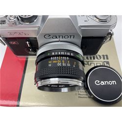 Canon FTb camera body, serial no. 715838, with 'Canon FD 50mm 1:1.8' lens, serial no. 207888, in original box, together with Canon FTb camera body, serial no. 557817, with 'Canon FD 35mm 1:3.5 S.C' lens, serial no. 126210 and Canon EX Auto camera body, serial no. 296244 with 'Canon EX 50mm 1:1.8' lens, serial no. 380869  