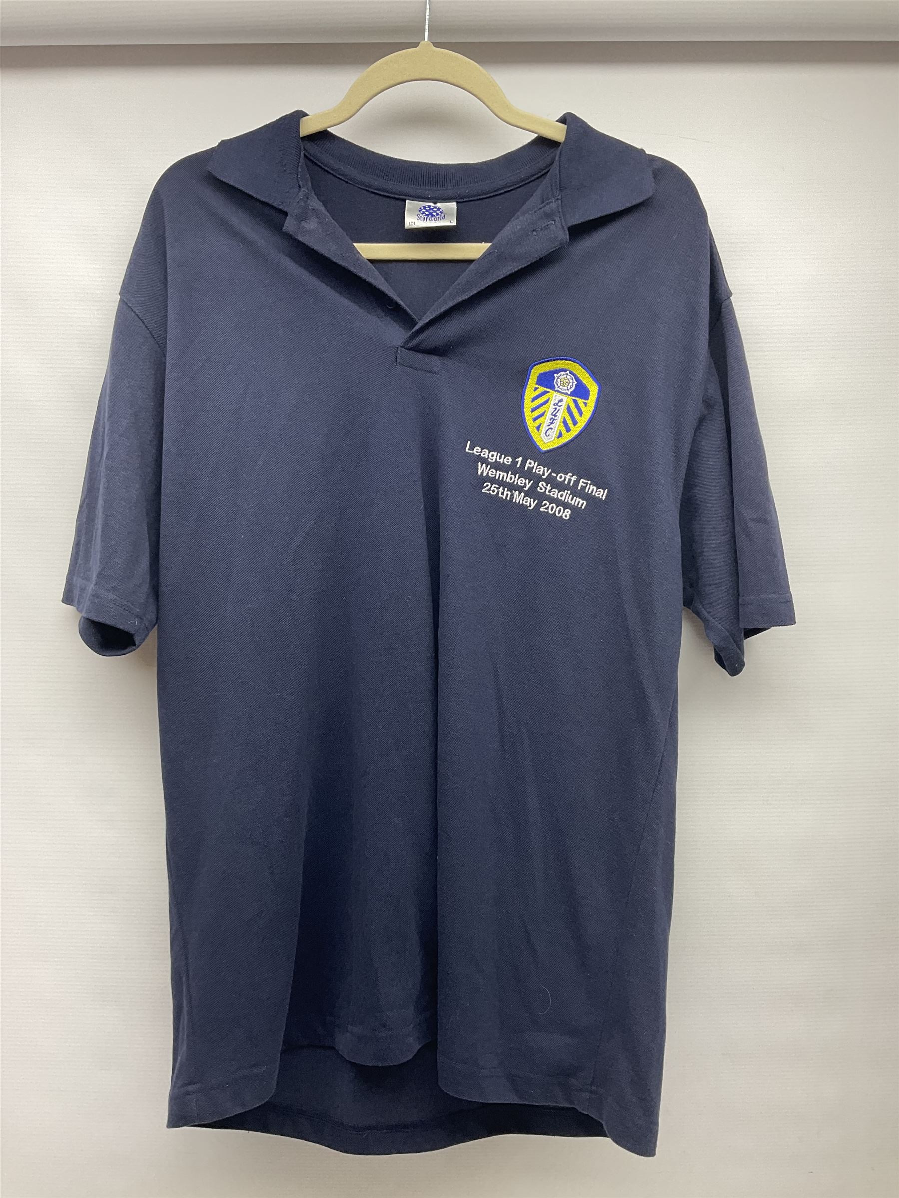 Fourteen items of replica sporting clothing including Leeds United football club shirts, England jerseys etc