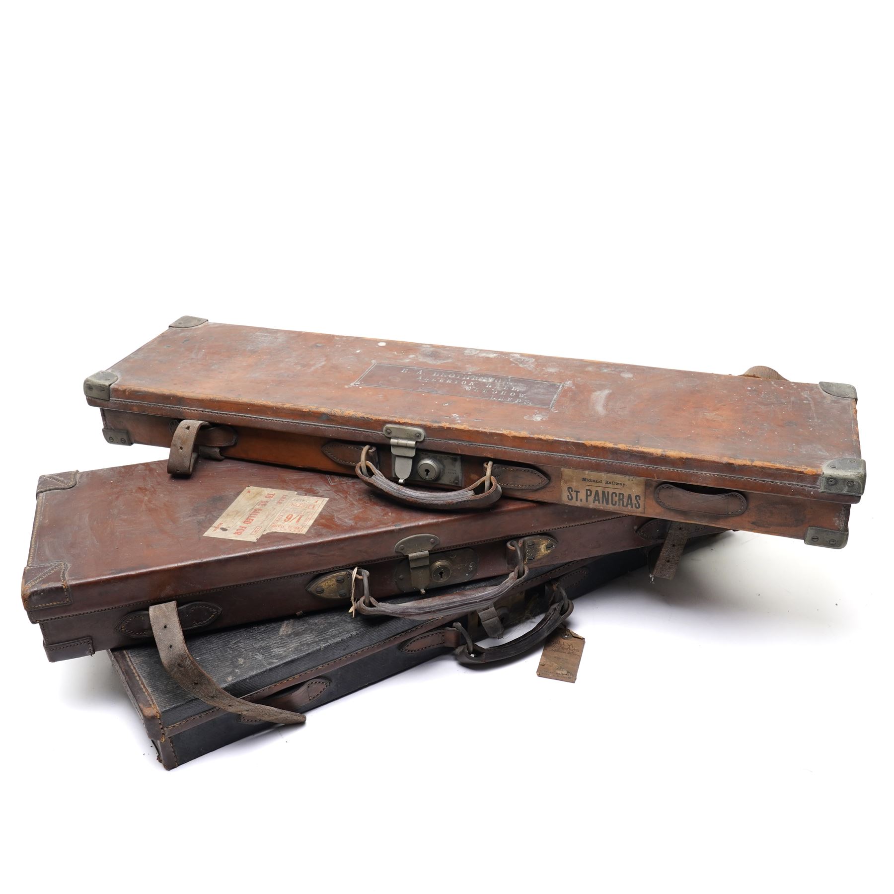 *Leather shotgun case with the label of James Purdey & Sons, London, inscribed 'Colonel Sir Edward Allen Brotherton, Bart MP, Kirkham Abbey, Via York 'and two others with the labels of Linsley Brothers (3)From the Kirkham Hall Attic & Cellar Collection, sold without reserve