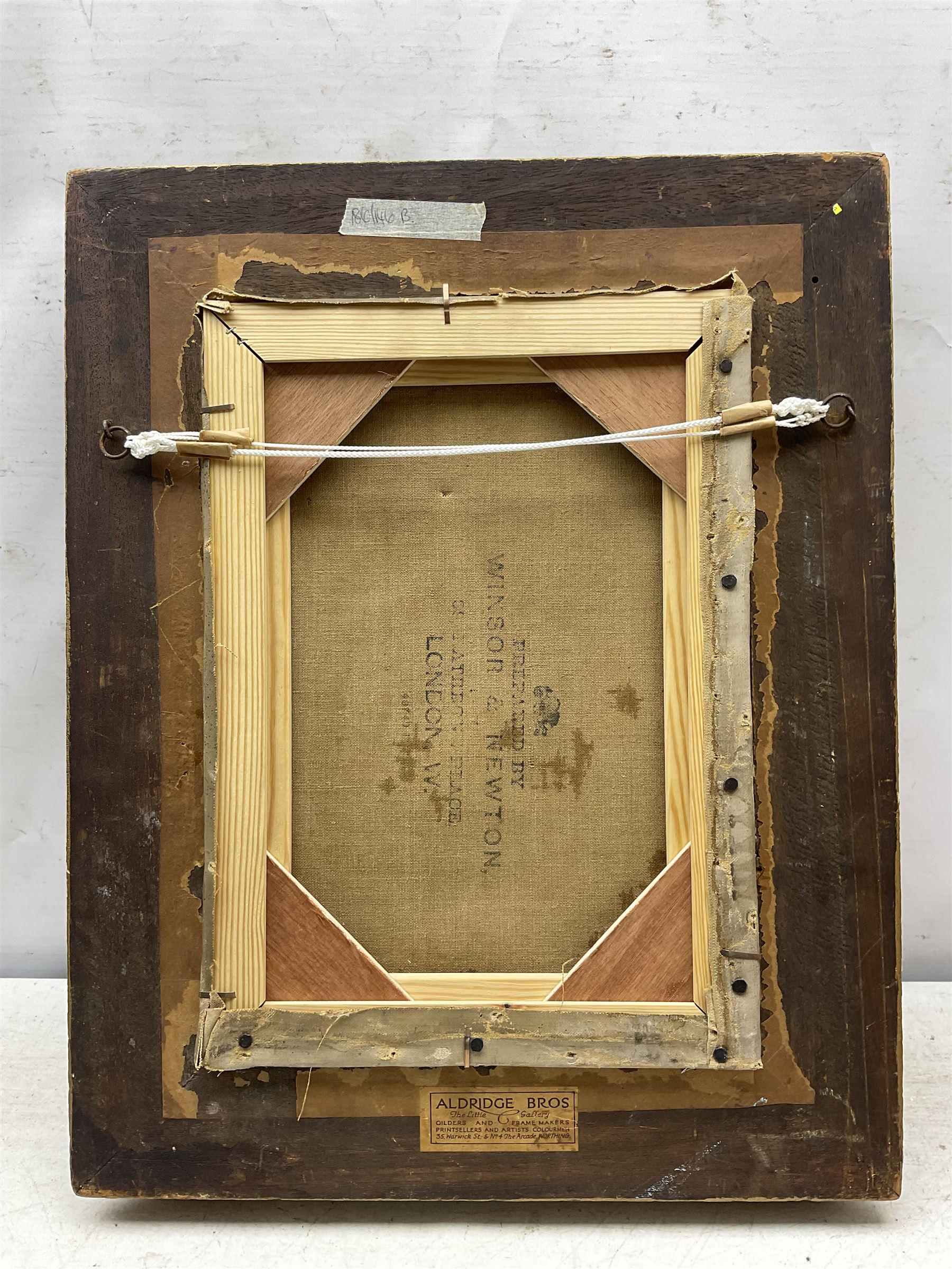 Theodore Blake Wirgman (British 1848-1925): Portrait of a Lady in her Study, oil on canvas signed 35cm x 24cm 