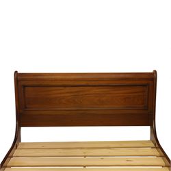 Willis & Gambier - French cherry wood double sleigh bed, with moulded panelled headboard and footboard, each with scroll ends, raised on shaped plinth supports