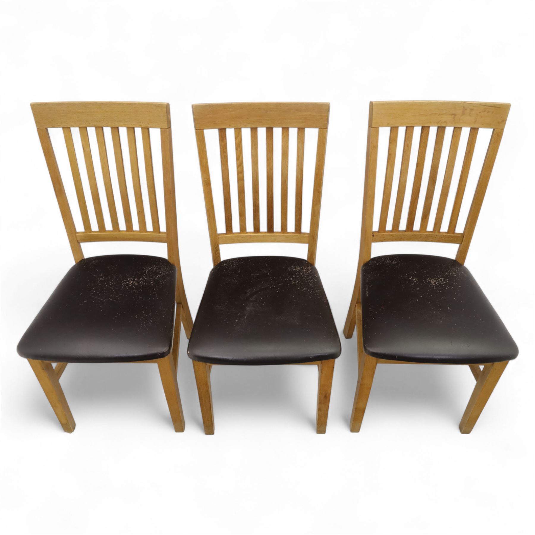 Contemporary set of six light oak dining chairs with faux leather cushion seats 